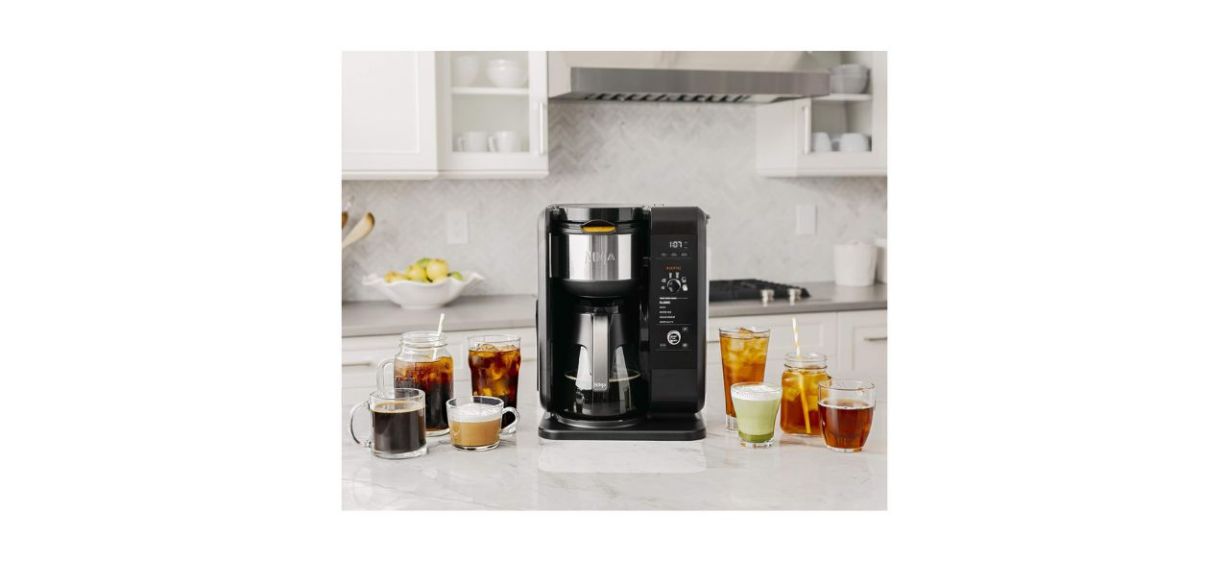 Ninja Hot and Cold Brew System on a counter next to both cold and hot brewed beverages