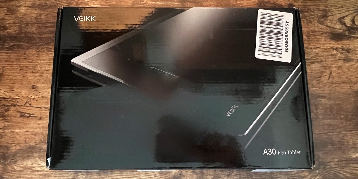 Veikk A30 V2 Drawing Tablet product box on wooden background Veikk A30 V2 Drawing Tablet product box on wooden background