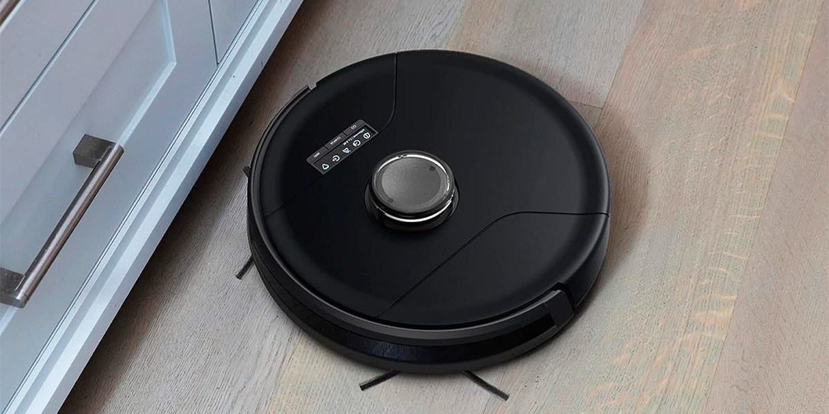 Bobsweep Bob PetHair SLAM on on vinyl plank flooring next to drawer