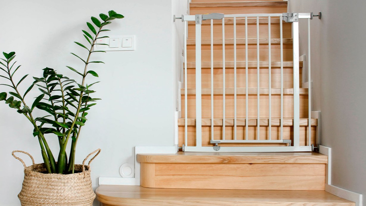 A baby gate installed on a staircase