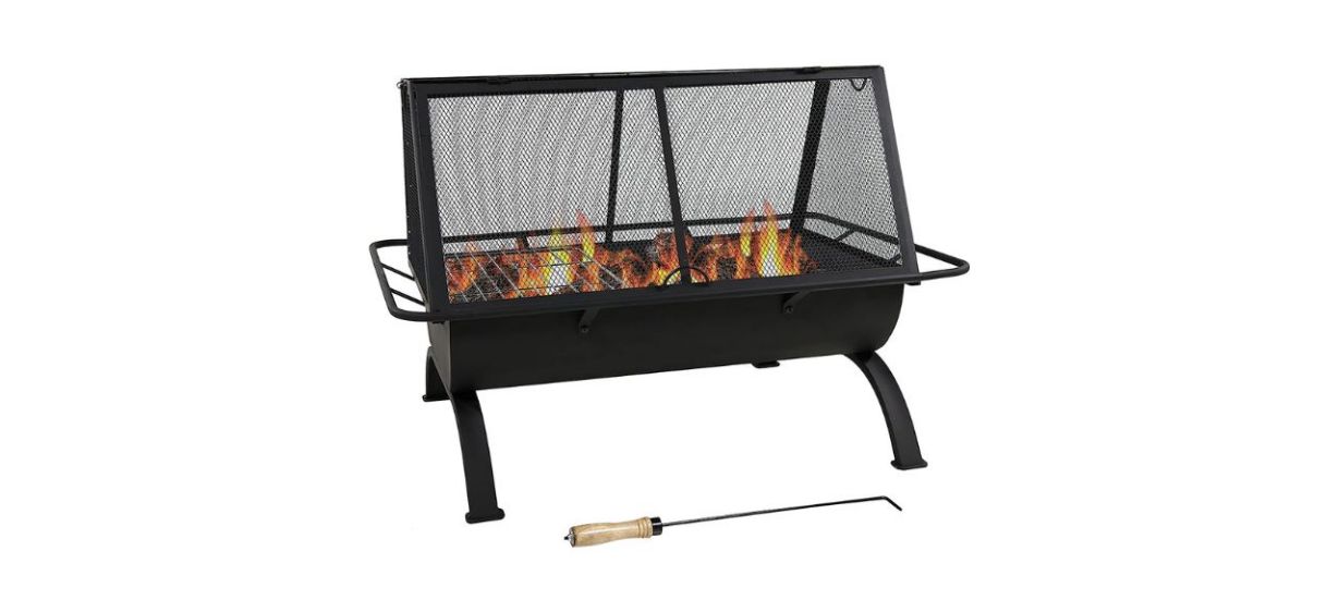 A black metal rectangular fire pit with a screen on it and a poker lying next to it