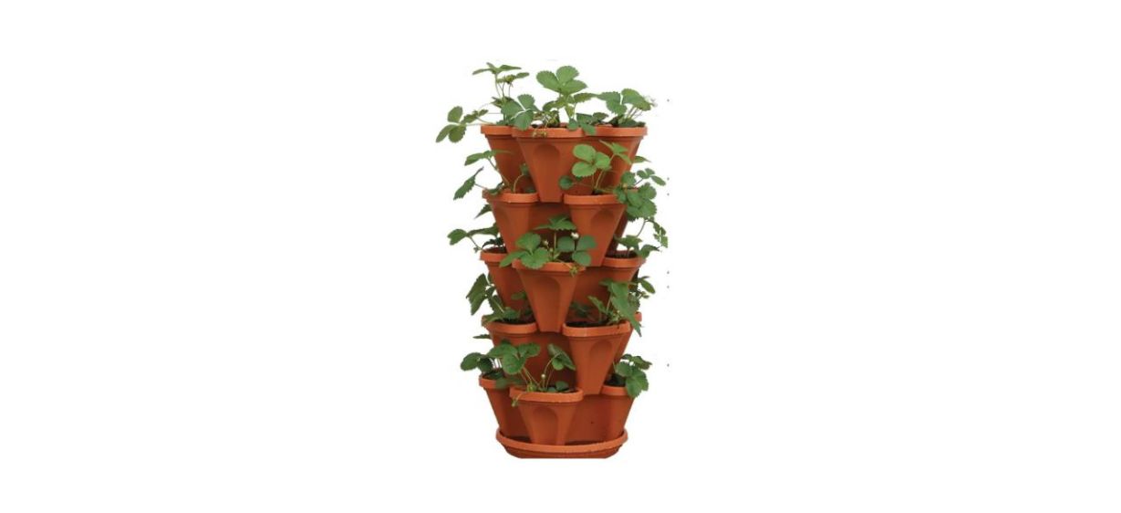 A terra cotta-colored plastic stacked herb planter