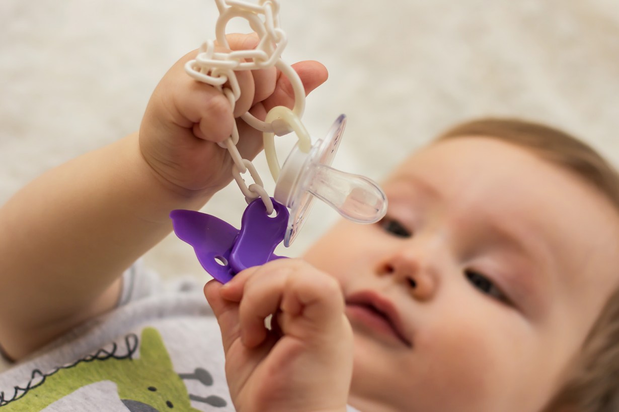a child with a pacifier